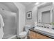 Clean bathroom featuring a walk-in shower, toilet, and vanity with a sink, complemented by neutral tones at 3623 S Agave Way, Chandler, AZ 85248