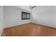 Bright bedroom with wood floors, ceiling fan and window with blinds at 3623 S Agave Way, Chandler, AZ 85248