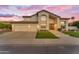 Inviting stucco home with a spacious three-car garage and manicured landscaping at 3623 S Agave Way, Chandler, AZ 85248