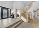 Spacious foyer with tile floors, a staircase, and a decorative front door with glass accents at 3623 S Agave Way, Chandler, AZ 85248