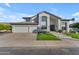 Beautiful two-story home featuring a three-car garage, stone accents, and a well-maintained front yard at 3623 S Agave Way, Chandler, AZ 85248