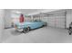 Spacious garage with painted floors featuring a classic car at 3623 S Agave Way, Chandler, AZ 85248