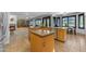 Spacious kitchen boasting wood floors and cabinets plus fireplace and wine storage at 3623 S Agave Way, Chandler, AZ 85248