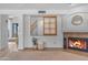 Living room showcasing a fireplace, mantle and a decorative window at 3623 S Agave Way, Chandler, AZ 85248