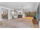 Spacious living room featuring a fireplace, wine cellar, and staircase to the second level at 3623 S Agave Way, Chandler, AZ 85248