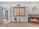 Living room showcasing a fireplace, mantle and a decorative window at 3623 S Agave Way, Chandler, AZ 85248