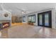Open living space with a fireplace, wine cellar, and decorative glass doors at 3623 S Agave Way, Chandler, AZ 85248
