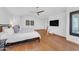 Large main bedroom with hardwood flooring, a king bed, and simple decor, creating a relaxing retreat at 3623 S Agave Way, Chandler, AZ 85248