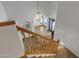 View from the top of the staircase, overlooking the home's foyer with chandelier at 3623 S Agave Way, Chandler, AZ 85248