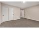 Neutral bedroom featuring carpeted floors, a ceiling light, and a closet with folding doors at 3885 E Lambeth Pl, San Tan Valley, AZ 85140
