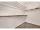Bright, walk-in closet featuring wood supports for ample storage and organization at 3885 E Lambeth Pl, San Tan Valley, AZ 85140