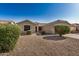 Inviting single-story home with desert landscaping in front, featuring low-water plants at 3885 E Lambeth Pl, San Tan Valley, AZ 85140