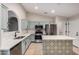 Bright kitchen with stainless steel appliances, white countertops, and eye-catching mosaic accents at 3885 E Lambeth Pl, San Tan Valley, AZ 85140