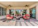 Spacious covered patio featuring comfortable seating areas and ceiling fans for relaxing outdoors at 3933 E Meadowview Dr, Gilbert, AZ 85298