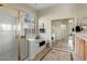 Bright bathroom featuring a separate shower and tub, tiled flooring, and modern fixtures and design at 3933 E Meadowview Dr, Gilbert, AZ 85298