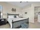 Well-lit bedroom with a decorative zebra theme, comfortable bed, side tables and a large window with shutters at 3933 E Meadowview Dr, Gilbert, AZ 85298
