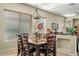 Inviting dining room with a wooden table, six chairs, and natural light streaming through the windows at 3933 E Meadowview Dr, Gilbert, AZ 85298