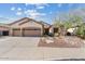 Well-maintained single-story home with desert landscaping, a three car garage, and a welcoming facade at 3933 E Meadowview Dr, Gilbert, AZ 85298
