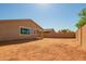 Spacious backyard with block wall and xeriscaping at 40800 W Rio Grande Dr, Maricopa, AZ 85138