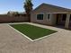The backyard features a patch of artificial turf surrounded by gravel landscaping for easy maintenance at 40800 W Rio Grande Dr, Maricopa, AZ 85138