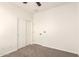 Cozy bedroom with neutral walls and a door leading to the closet at 40800 W Rio Grande Dr, Maricopa, AZ 85138
