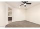 Bright bedroom featuring ensuite bathroom and neutral colored carpet at 40800 W Rio Grande Dr, Maricopa, AZ 85138