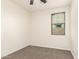 Comfortable carpeted bedroom with neutral walls and a window at 40800 W Rio Grande Dr, Maricopa, AZ 85138