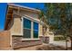 This lovely home features stone accents, manicured desert landscaping, and well-maintained window exteriors at 40800 W Rio Grande Dr, Maricopa, AZ 85138