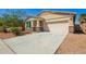 Charming single-Gathering home with a well-manicured lawn, desert landscaping, and attached two-car garage at 40800 W Rio Grande Dr, Maricopa, AZ 85138
