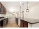 Spacious kitchen featuring granite countertops and stainless steel dishwasher at 40800 W Rio Grande Dr, Maricopa, AZ 85138