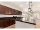 Spacious kitchen featuring granite countertops and stainless steel microwave at 40800 W Rio Grande Dr, Maricopa, AZ 85138
