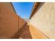 Sideyard with block wall and xeriscaping at 40800 W Rio Grande Dr, Maricopa, AZ 85138