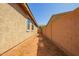 Sideyard with block wall and xeriscaping at 40800 W Rio Grande Dr, Maricopa, AZ 85138