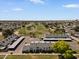 Scenic aerial view of townhomes near a lush golf course, perfect for relaxation and recreation at 418 E Woodman Dr, Tempe, AZ 85283