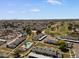 Drone shot capturing the community's pool, residences, and nearby golf course at 418 E Woodman Dr, Tempe, AZ 85283