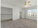Large bedroom with an opening to another floor and a closet at 418 E Woodman Dr, Tempe, AZ 85283