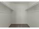 Walk-in closet with ample shelving, ready for organization at 418 E Woodman Dr, Tempe, AZ 85283
