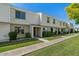 Exterior view of well-kept townhomes with tidy landscaping and inviting sidewalks at 418 E Woodman Dr, Tempe, AZ 85283