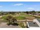 An aerial view of a meticulously maintained golf course, perfect for avid golfers with mature landscaping throughout at 418 E Woodman Dr, Tempe, AZ 85283