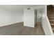 Bright living room featuring modern flooring and staircase at 418 E Woodman Dr, Tempe, AZ 85283