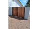 Wooden driveway gate in the backyard at 4309 E Alta Mesa Ave, Phoenix, AZ 85044