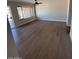 Spacious living room featuring modern flooring and large windows for natural light at 4309 E Alta Mesa Ave, Phoenix, AZ 85044