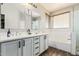 Bathroom with double vanity, tub, and modern fixtures at 4337 E Vaughn Ave, Gilbert, AZ 85234