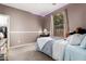 Comfortable bedroom featuring natural light, cozy carpet, and stylish furniture at 4337 E Vaughn Ave, Gilbert, AZ 85234
