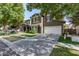 Two-story home featuring green exterior, red shutters, a well-kept lawn and long driveway at 4337 E Vaughn Ave, Gilbert, AZ 85234