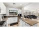 Well-lit kitchen with stainless steel appliances, granite countertops, and a convenient island at 4337 E Vaughn Ave, Gilbert, AZ 85234