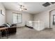 Loft space features neutral carpet, dark sofa, and staircase view at 4337 E Vaughn Ave, Gilbert, AZ 85234