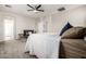 A spacious main bedroom with carpeted floors, a large bed, and natural light at 4337 E Vaughn Ave, Gilbert, AZ 85234