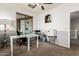 Home office with multiple windows, a modern desk setup, and a clean, functional workspace at 4337 E Vaughn Ave, Gilbert, AZ 85234