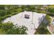 Aerial view of basketball court at neighborhood park featuring benches and picnic shelter, surrounded by mature trees at 4617 W Cottontail Rd, Phoenix, AZ 85086